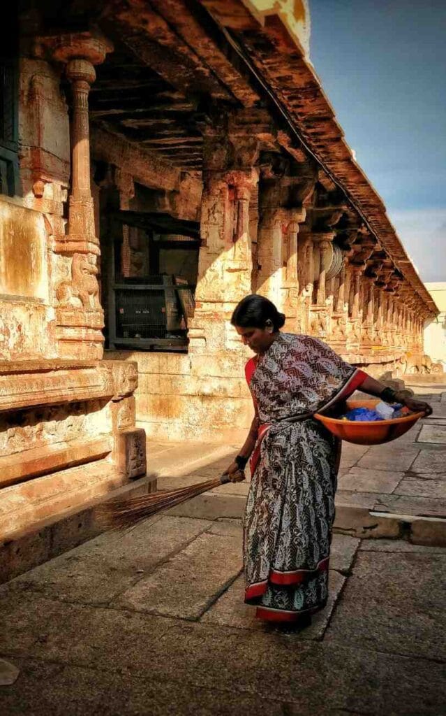 Woman cleaning premises of Maa Danteshwari Temple in Dantewada, Chhattisgarh